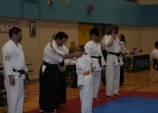 Xavier receiving his gold medal in Kata