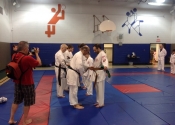 Belt level promotions Tokon Dojo June 2015 Beaconsfield - receiving belt from Sensei Manoli