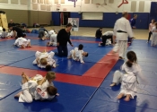 Bully-proofing and karate class for parents and children. Beaconsfield Recreation Centre. Dec. 2017. Beautiful to see all these hard working kids and parents. We develop an 'Attitude' based training backed by technical knowledge of what to do if bullied. Sensei Manoli guiding his young students. Parents learn and encourage the children in the class.