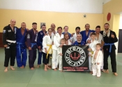 Group picture with the Arena BJJ logo