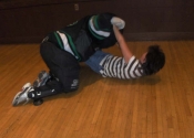 Brought to the ground during a physical confrontation