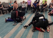 Morneau/Chepell 'hands-on', simulation oriented, women's self-defence workshop. Second group of wild, motivated and determined women. Downtown Montreal, Canada. Most attacks end up in a horizontal position (ground, bed, table...). Know what to do if brought to the ground - Oct. 2019