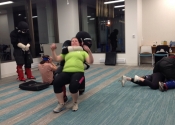 Morneau/Chepell 'hands-on', simulation oriented, women's self-defence workshop. Second group of wild, motivated and determined women. Downtown Montreal, Canada. Most attacks end up in a horizontal position (ground, bed, table...). Know what to do if brought to the ground.  Oct. 2019